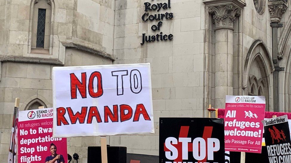 Protesters against the Rwanda asylum plan outside the Royal Courts of Justice in London