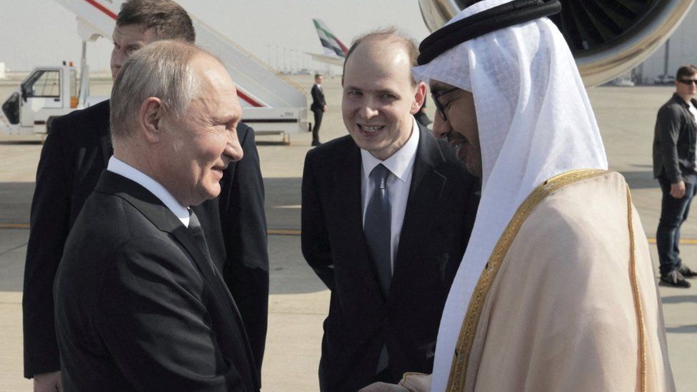 Vladimir Putin is welcomed by UAE Minister of Foreign Affairs Sheikh Abdullah bin Zayed bin Sultan Al Nahyan at the Abu Dhabi International Airport
