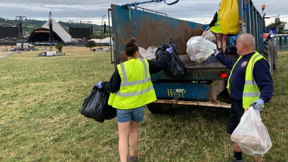 Volunteers loading rubbish onto a truck