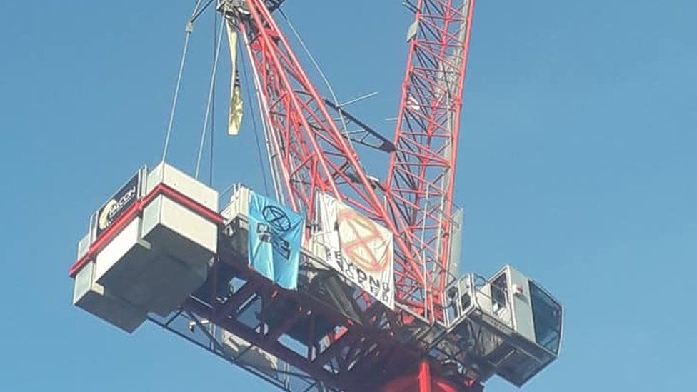 Norwich Extinction Rebellion protester admits crane chain offence - BBC ...