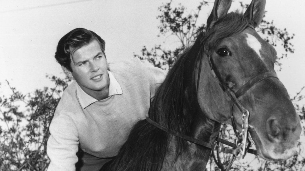 Sir Roger Moore riding 1955