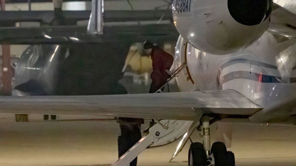 American basketball star Brittney Griner gets out of a plane after landing at the JBSA-Kelly Field Annex runway on December 9, 2022 in San Antonio