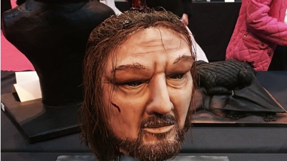 A cake version of Ned Stark's head on a spike