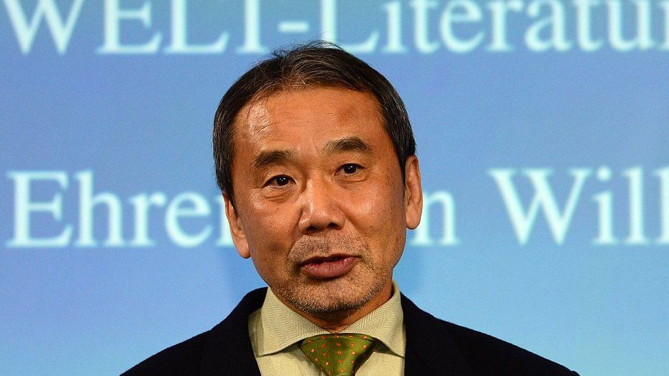Japanese writer Haruki Murakami poses for photographers prior to an award ceremony for the Germany's Welt Literature Prize bestowed by the German daily Die Welt, in Berlin on 7 November 2014.