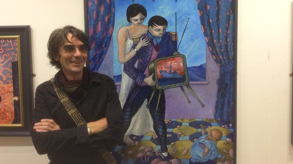 Ceri Pritchard with one of his paintings