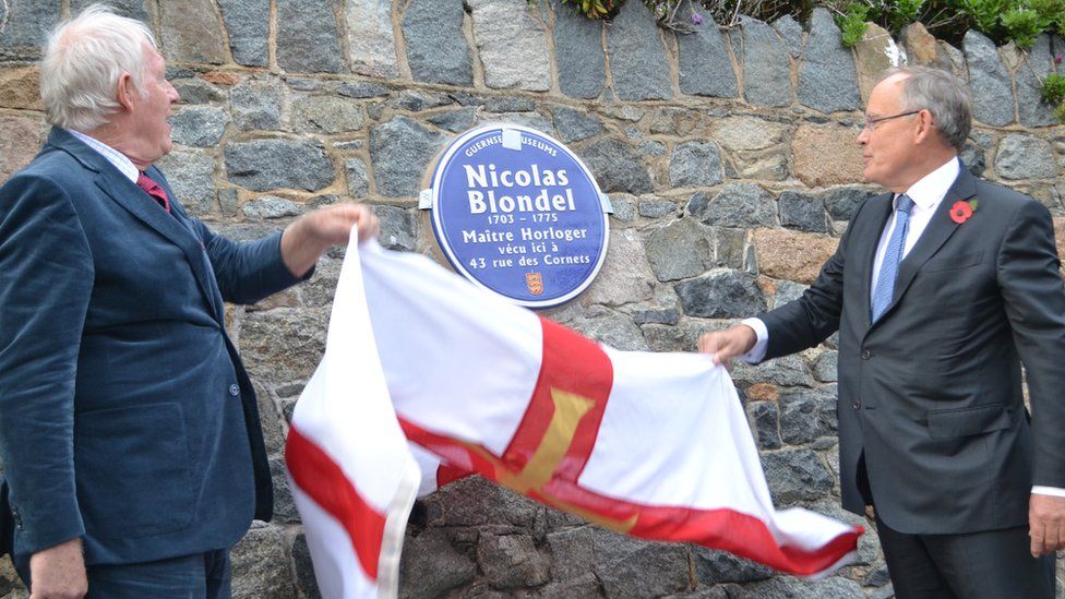 Geoff Dorey (left) and Sir Richard Collas (right) unveil a blue plaque to Nicolas Blondel