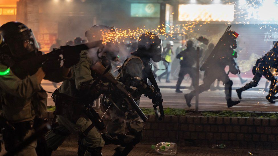 Riot police fire teargas as they charge on a street on November 2, 2019 in Hong Kong, China.
