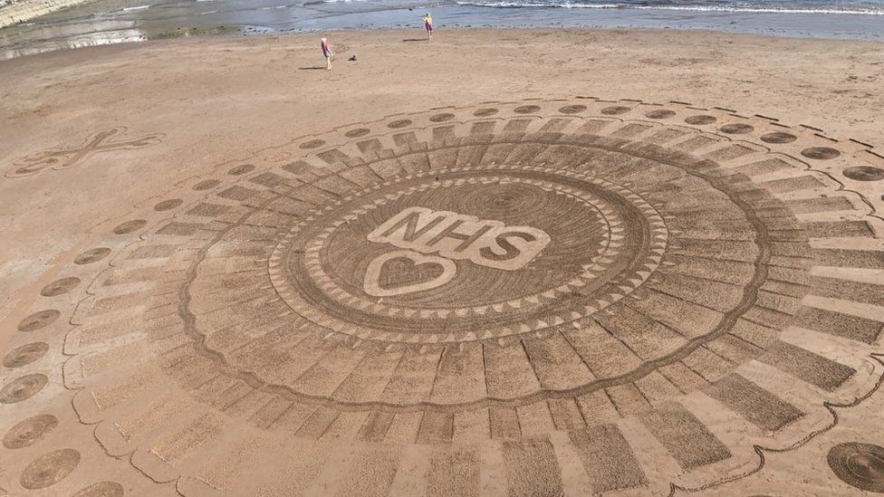 Sand art for the NHS on Torquay beach