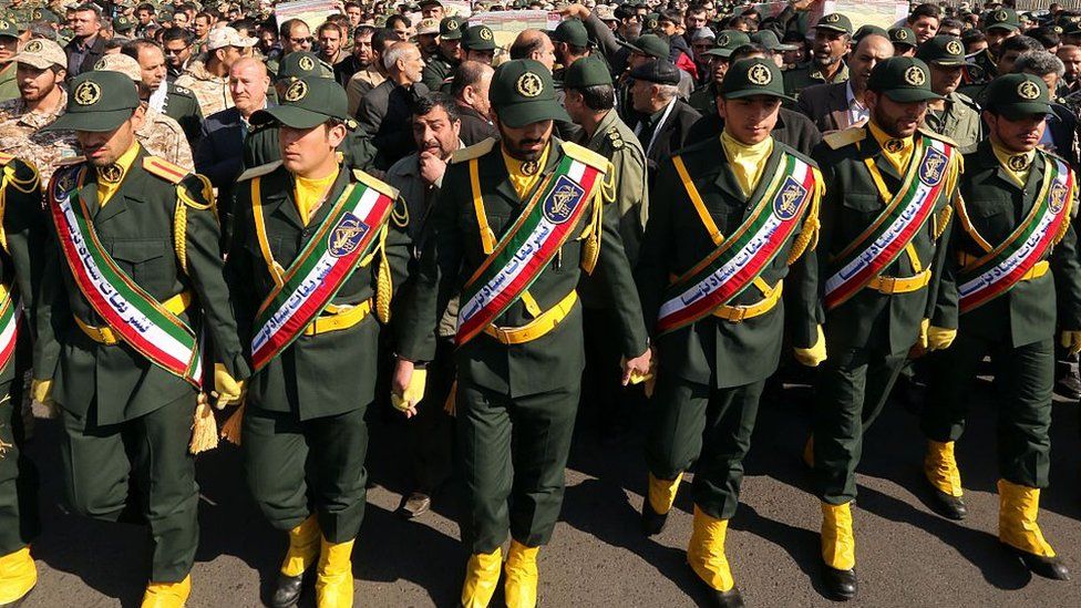 Members of the Iranian Revolutionary Guard carry the casket of Iran's Revolutionary Guards Brigadier General Mohsen Ghajarian, who was killed in the northern province of Aleppo by jihadists in Syria, during their funeral procession in the capital Tehran, on February 6, 2016.
