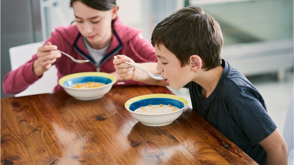 Kids eating cereal