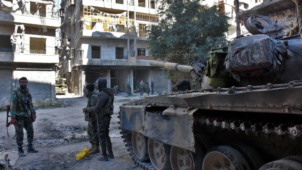 Syrian pro-government forces hold a position in Aleppo's Old City on 8 December 2016
