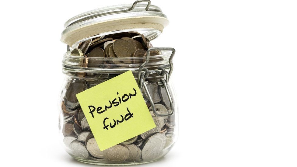 A jar of cash with 'pension fund' written on it