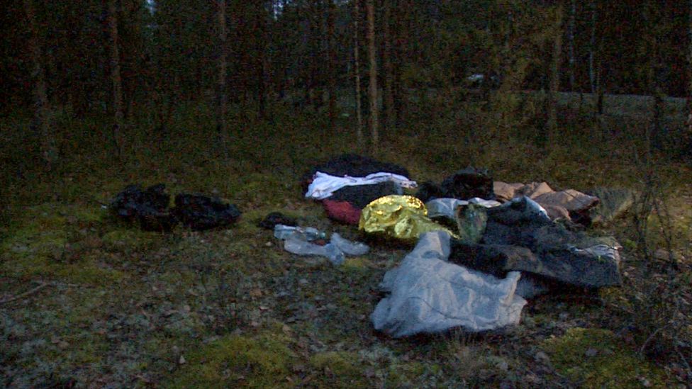 Blankets and other belongings discarded in the forest