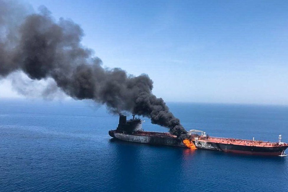 The Norwegian-owned crude oil tanker Front Altair is seen on fire in the Gulf of Oman