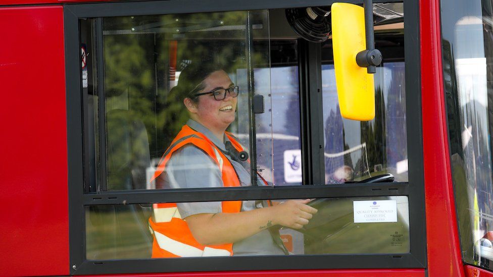 Isobel driving a bus