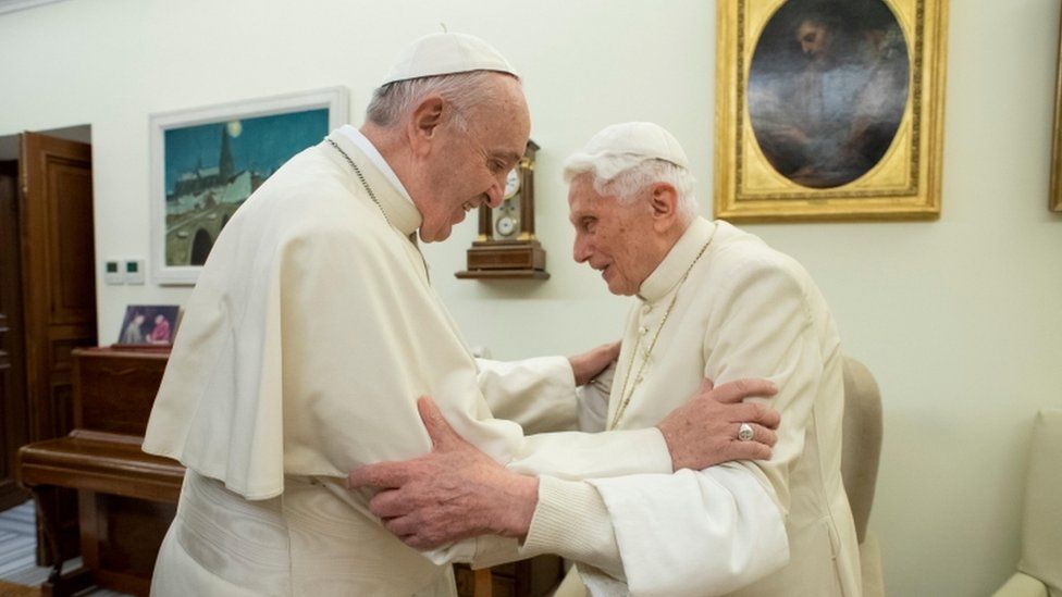 Pope Francis and Pope Benedict embracing in the Vatican