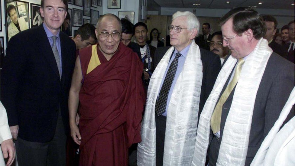 Mr Mallon argued with Peter Mandelson, pictured left of the Dalai Lama