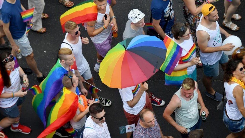People march with their rainbow colors from the parliament building in Budapest downtown during the lesbian, gay, bisexual and transgender (LGBT) Pride Parade in the Hungarian capital
