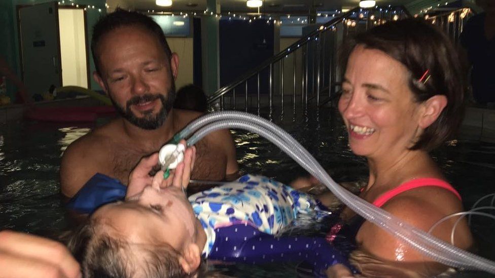 Evelyn Nolan with parents