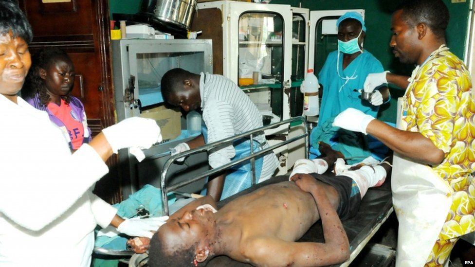 Hospital staff attend to injured people after two bomb blasts at the city centre in Jos, Nigeria (06 July 2015)