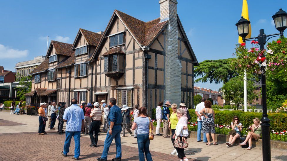 A tourist group waiting in front of Shakespeare's Birthplace at Henley Street. Shakespeare's Birthplace