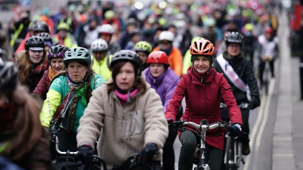 Protesters cycle through London