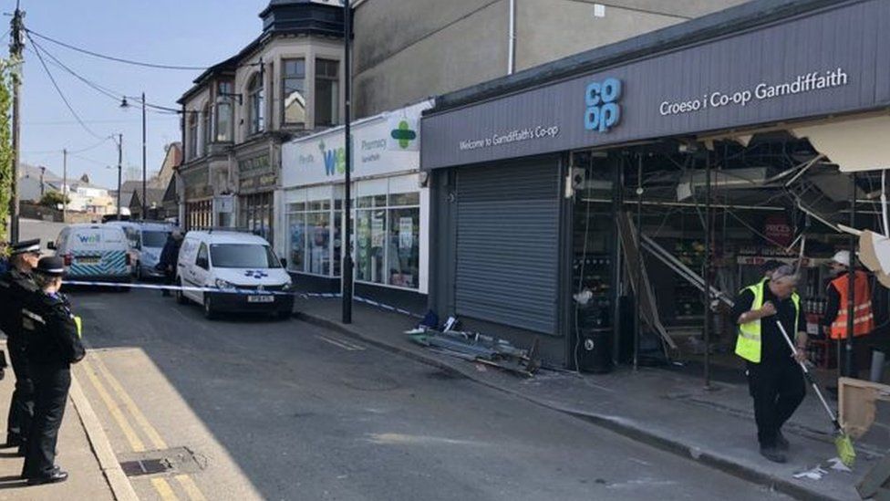 Broken Co-op store front following ram raid attack