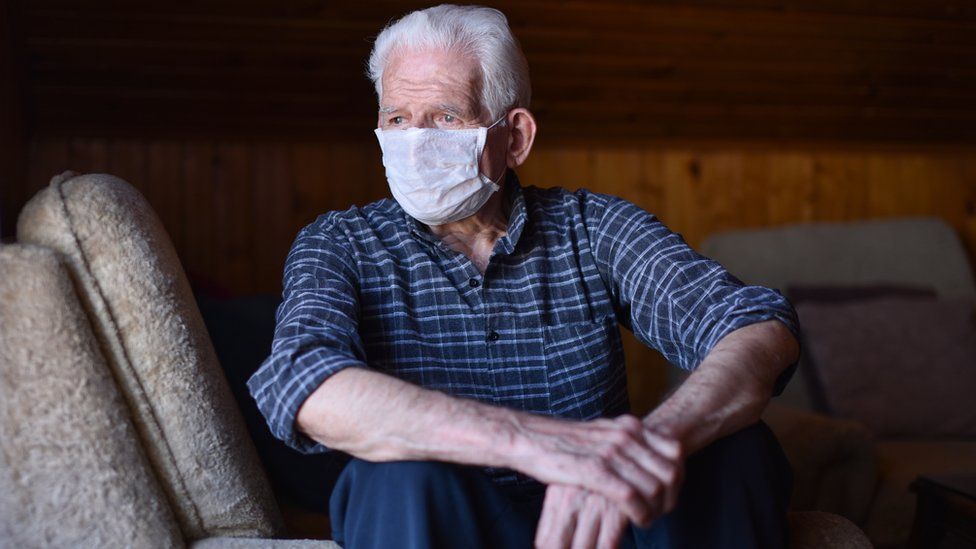 elderly man in face mask