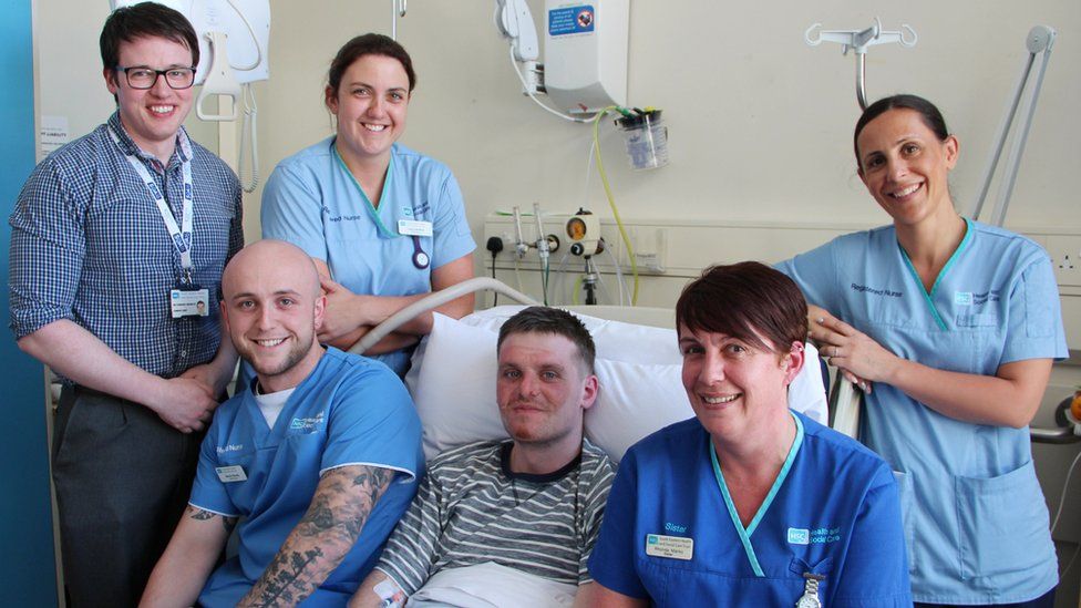 Matthew Bryce with staff at Ulster Hospital