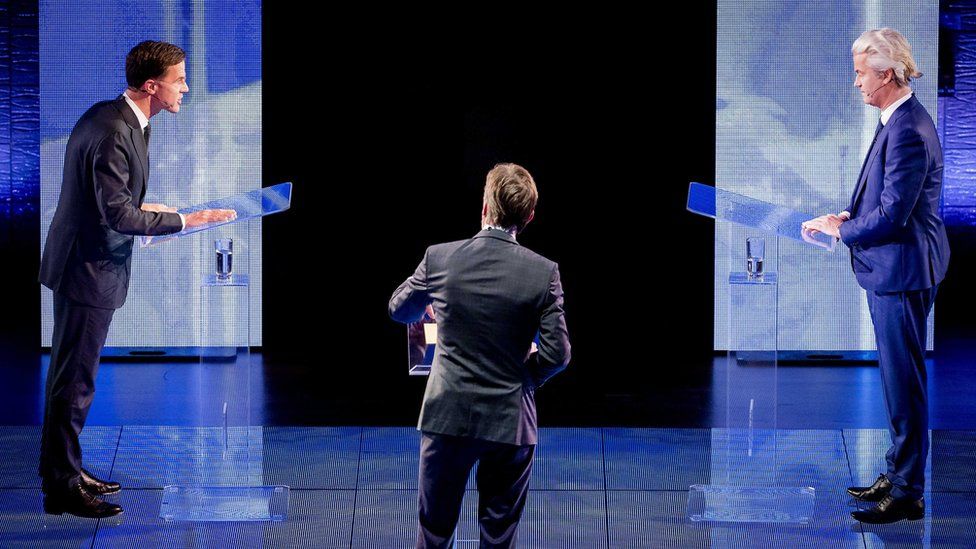 Dutch Prime Minister Mark Rutte (L) of the Liberal Party (VVD) and the right-wing Freedom Party (PVV) leader Geert Wilders (R) face each other during a TV debate