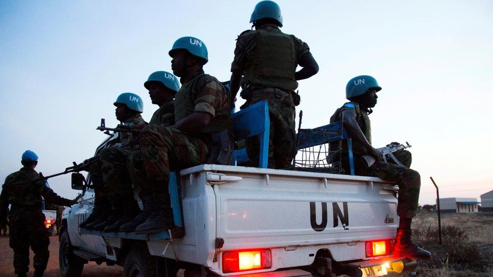 Peacekeeper troops from Ethiopia and deployed in the United Nations (UN) Interim Security Force for Abyei (UNISFA) patrol in a UN vehicle at night in Abyei town, Abyei state, on December 14, 2016.