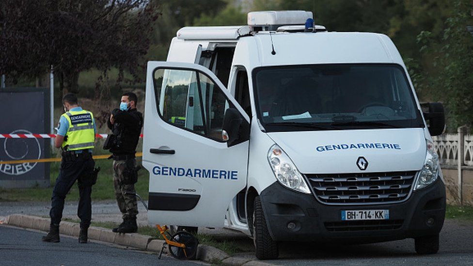 French gendarmes work next to the site where an ULM crashed in Loches