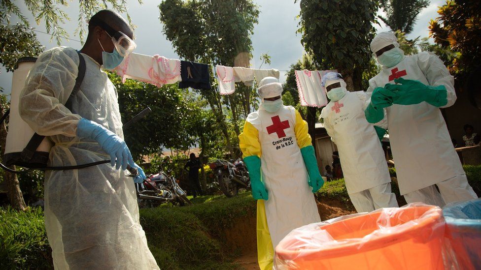 A Red Cross Safe and Dignified Burial team (SDB) respond to an Ebola alert in the DRC