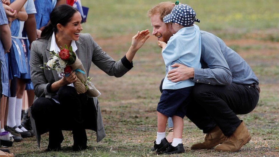 OCTOBER 17 Harry and Meghan speak to five year old Luke Vincent during their Royal tour of Australia
