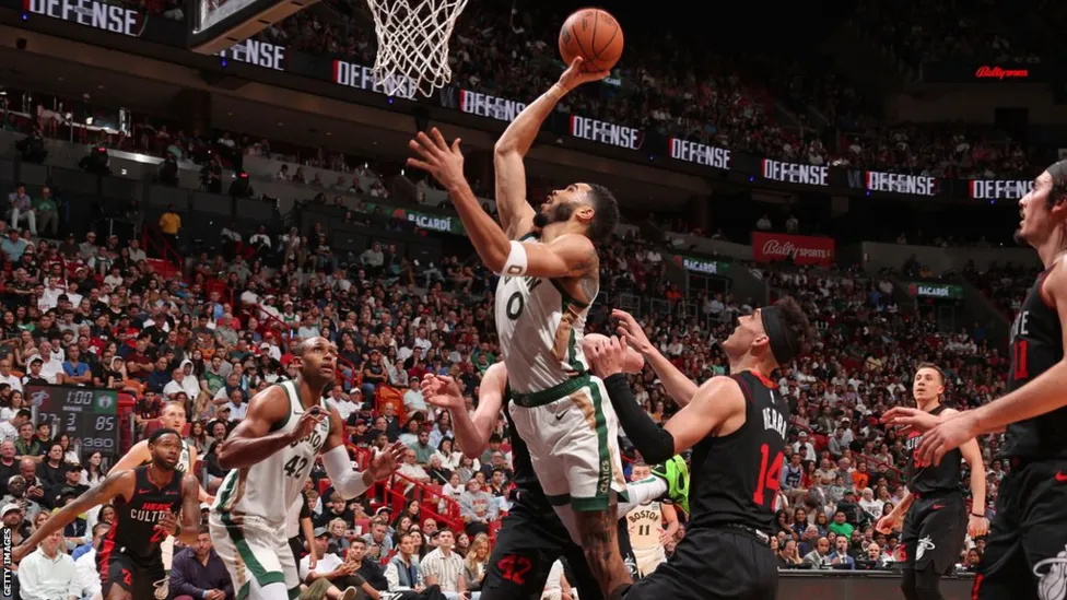 Jayson Tatum's Heroics Propel Boston Celtics to Edge Past Miami Heat in NBA Thriller.