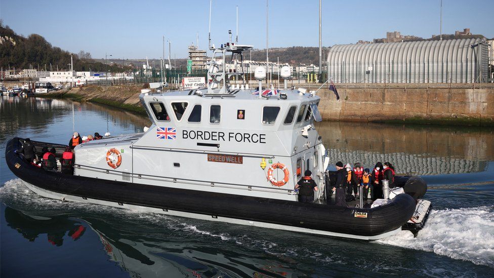 Migrants are brought into the Port of Dover onboard a Border Force vessel after being rescued while crossing the English Channel