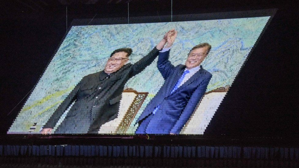 An image of Kim Jong-un and Moon Jae-in projected onto placards at the mass games in Pyongyang