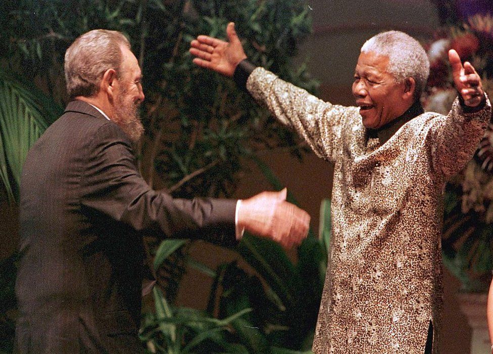 The late South African President Nelson Mandela greets Cuban leader Fidel Castro
