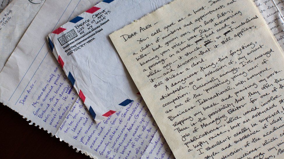 Fanned across a table, two hand-written cursive letters begin "Dear Alex–", while an envelope in the pile is clearly addressed to a Barack Obama in New York City.