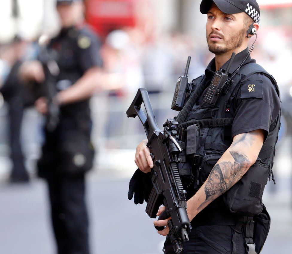A policeman with tattooo