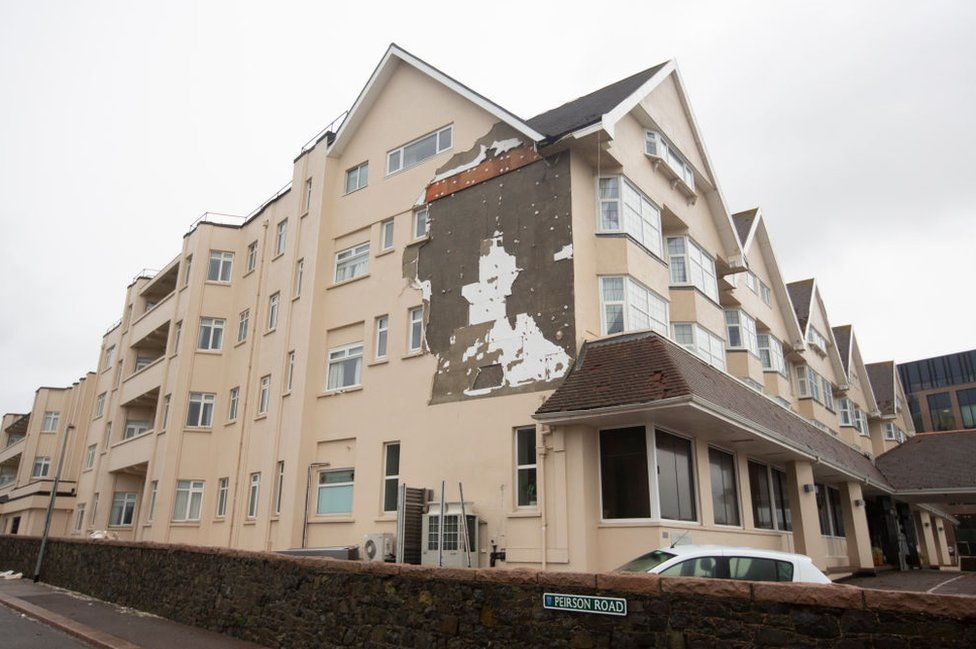 The Grand Hotel shows signs of damage, with the side rendering ripped, away after winds reaching 100 mph tore through the island in the early hours of the morning on November 2, 2023 in St Helier,