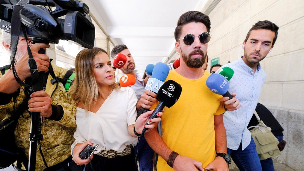 Jesus Escudero (C), one of the five men accused of gang raping a woman back in 2016 during the San Fermines Fiesta, leaves a court in Seville, 21 June