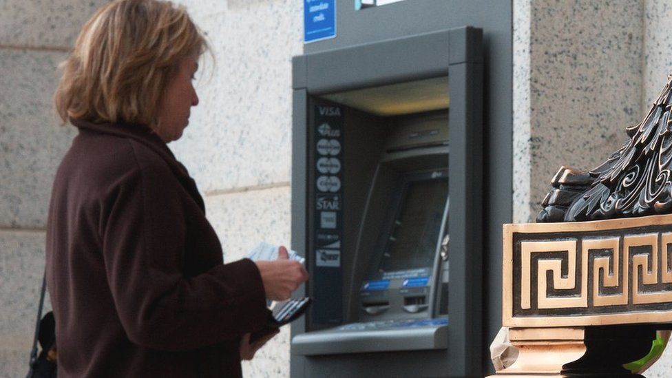 A woman at an ATM in the US