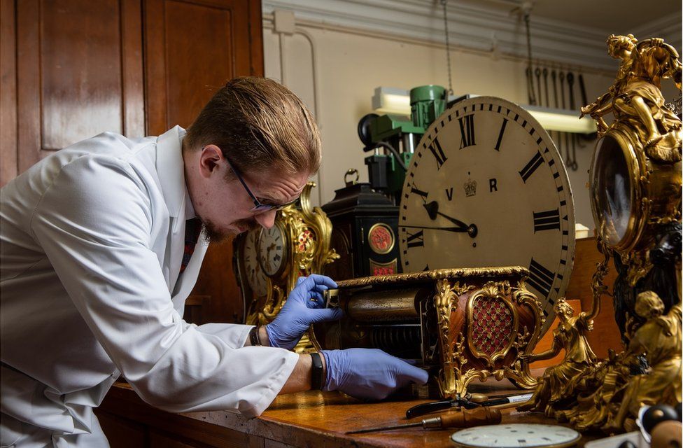 Fjodor works on a clock case in his workshop