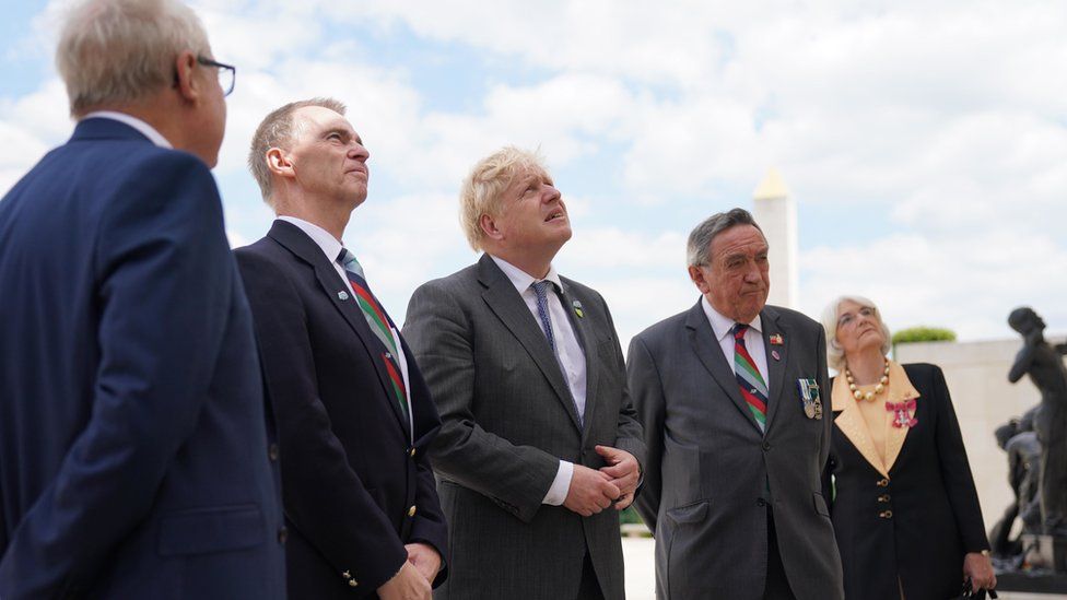 Prime Minister Boris Johnson (centre) looks at names of British personnel who lost their lives in the Falklands War at the Armed Forces Memorial at the National Memorial Arboretum in Alrewas, Staffordshire before a service to mark the 40th anniversary of the liberation of the Falkland Islands.