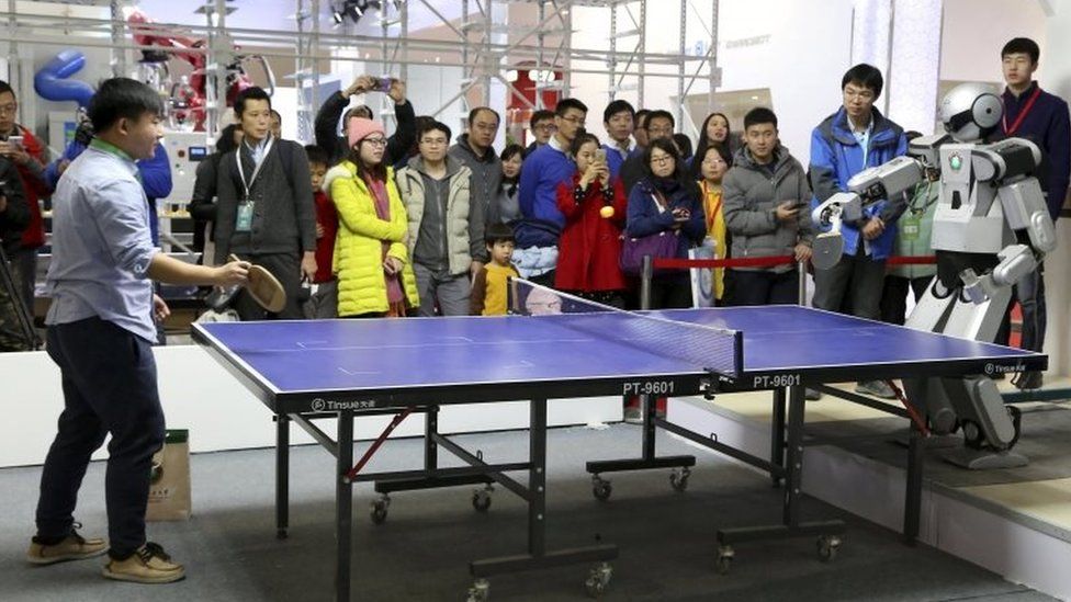Robot plays table tennis as the World Robot Conference in Beijing 24 november