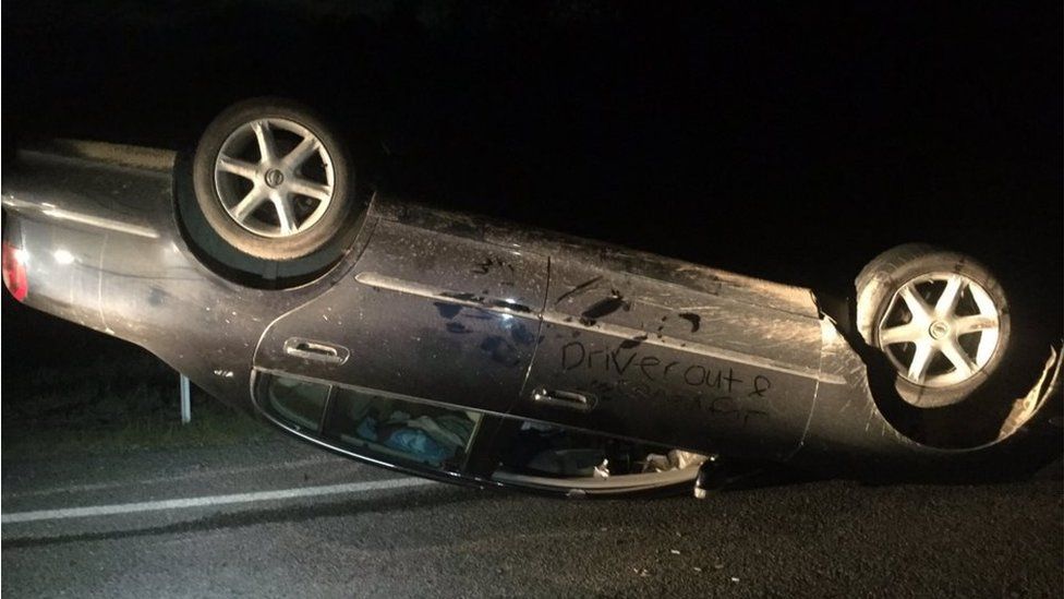 Picture of overturned car in aftermath of 13 November earthquake in New Zealand