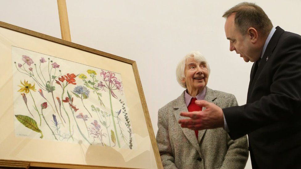 First Minister Alex Salmond with artist Dame Elizabeth Blackadder at the unveiling of his Christmas card for 2012 at the Royal Botanic Garden in Edinburgh.