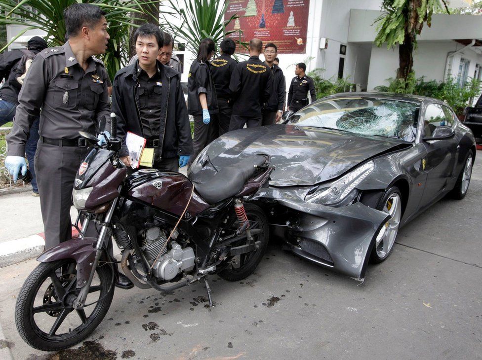 A file picture dated 3 September 2012 shows Thai police officers inspect a Ferrari car allegedly owned by run Vorayuth Yoovidhya (not in picture), grandson of the creator of Red Bull energy drink, in Bangkok, Thailand.