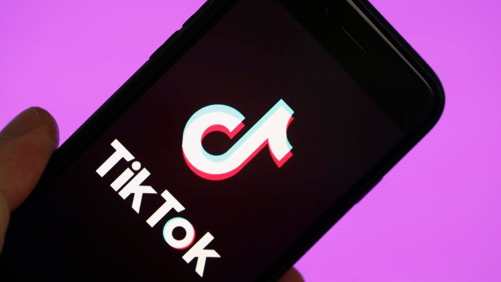 TikTok logo on phone